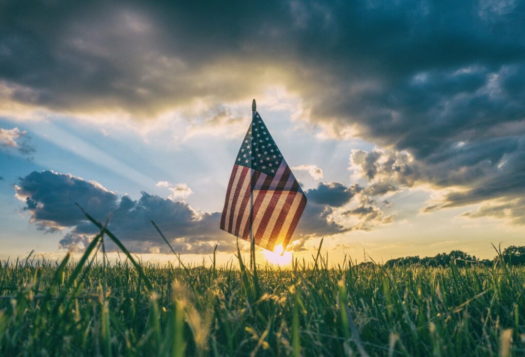 flag of USA on grass field

