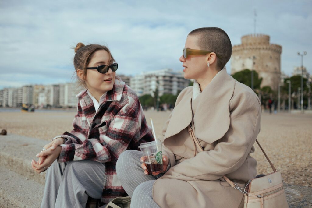 a man and a woman sitting next to each other

