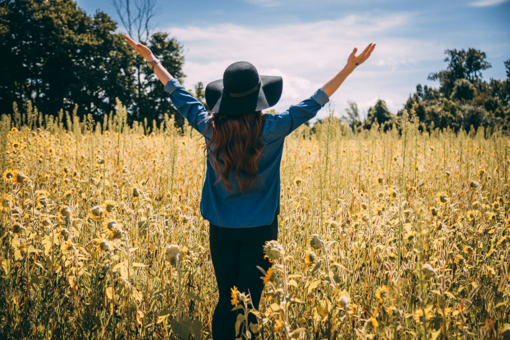woman raising both hands
