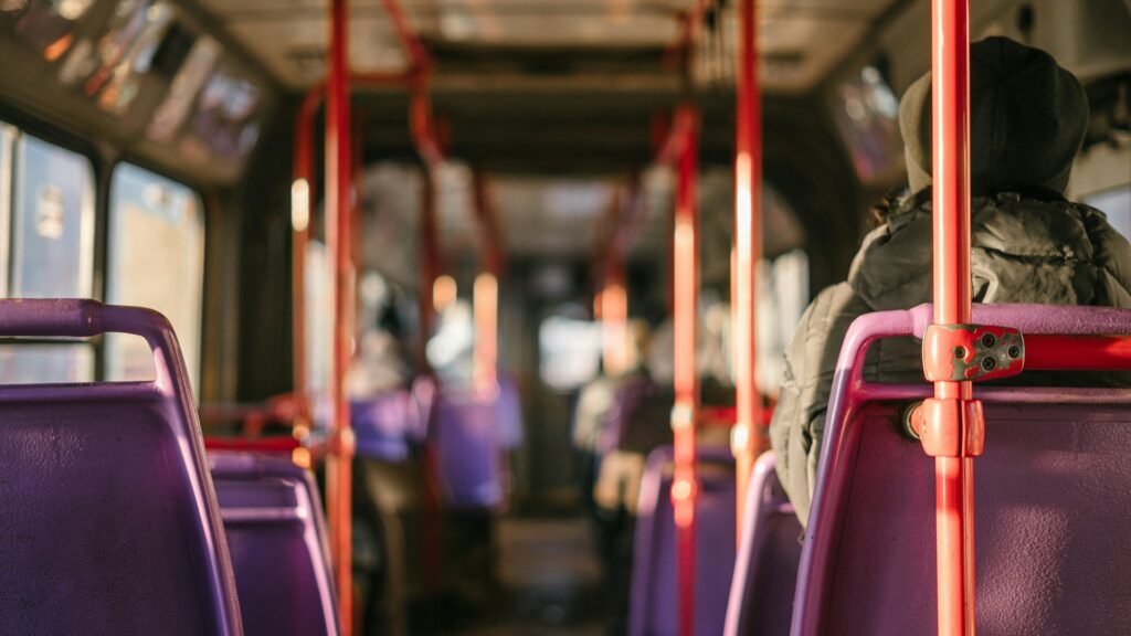 person standing in transportation vehicle

