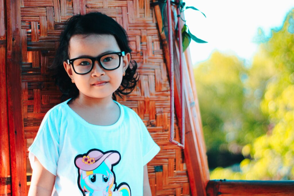 a girl wearing glasses
