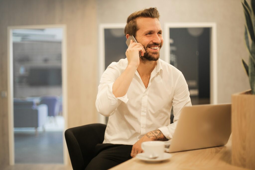 man using smartphone on chair
