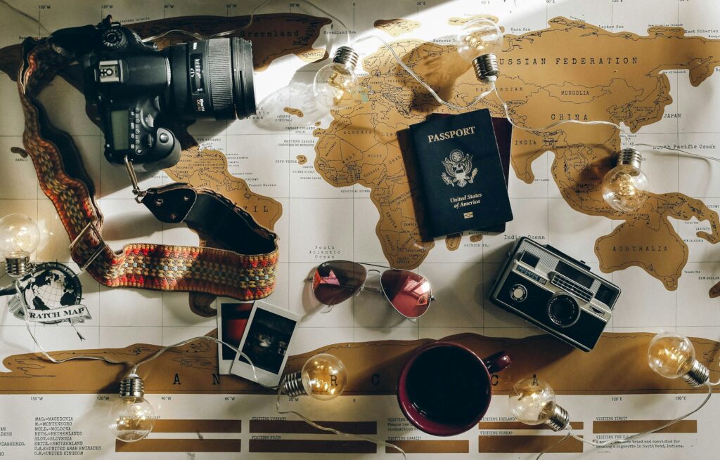 black DSLR camera near passport
