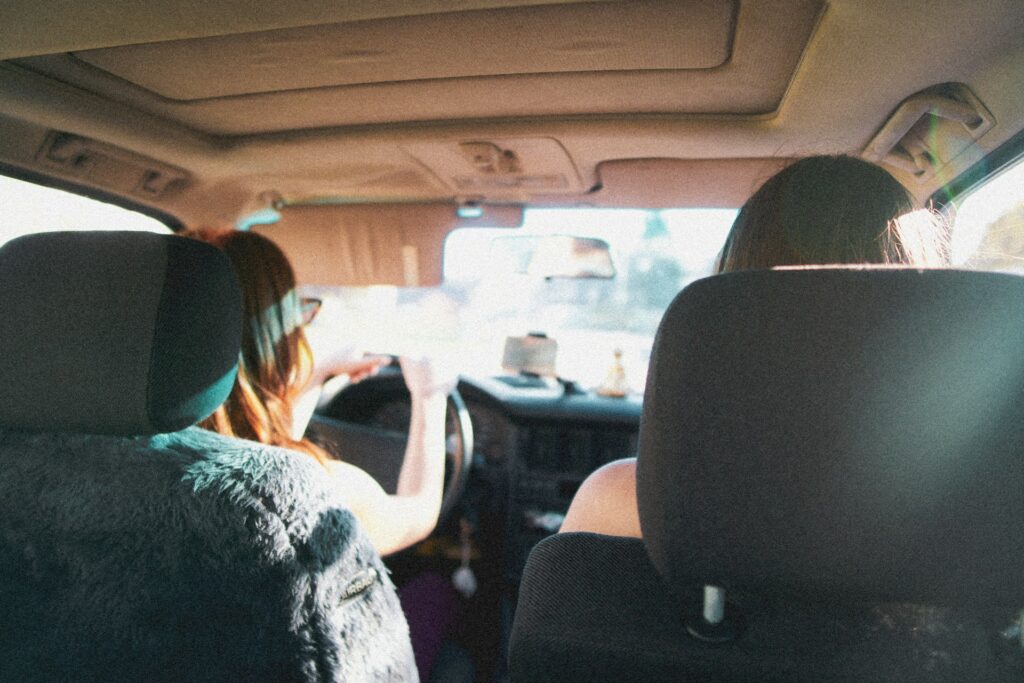people sitting on car seat
