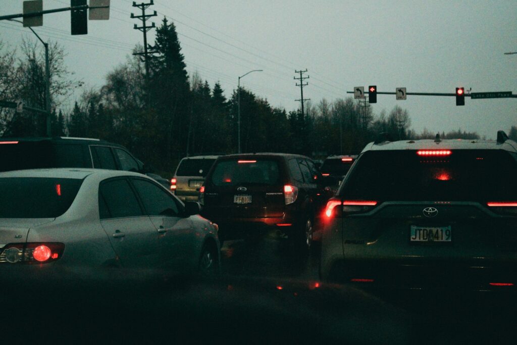 a bunch of cars that are sitting in the street
