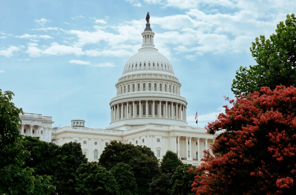 A view of the capitol building from across the street
