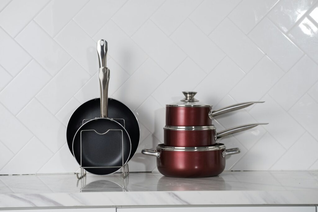 red and silver cooking pots
