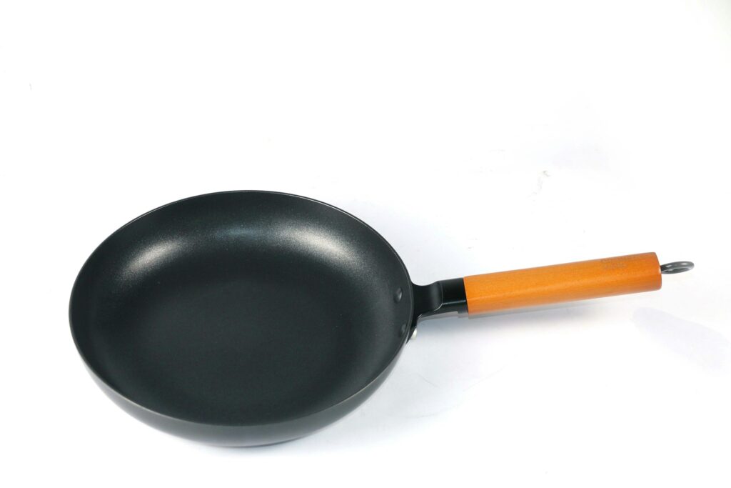 black and orange frying pan
