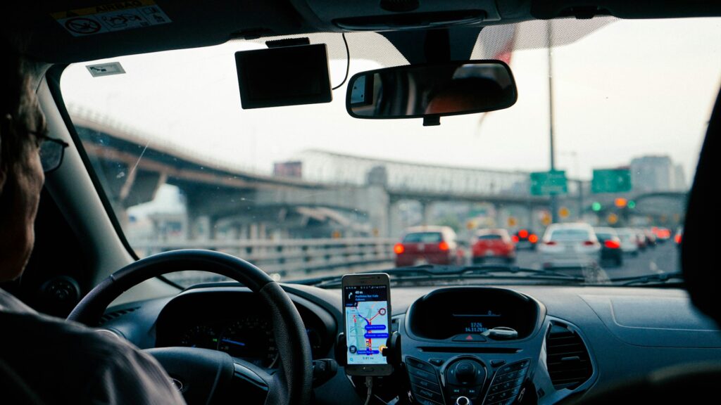 man driving vehicle with GPS system turned on
