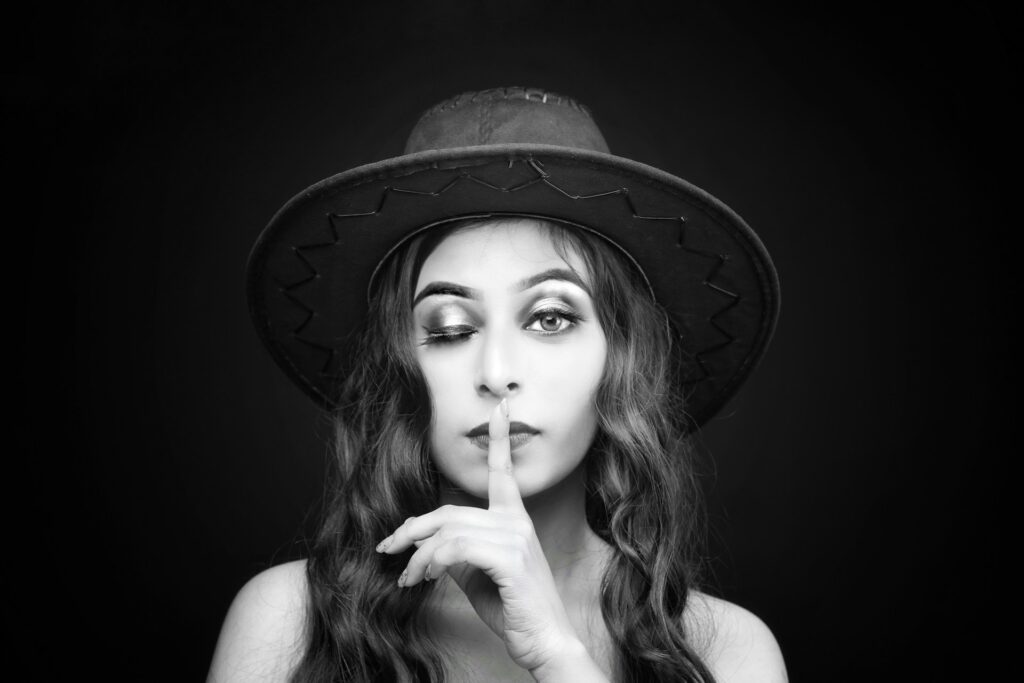 woman wearing hat grayscale photo
