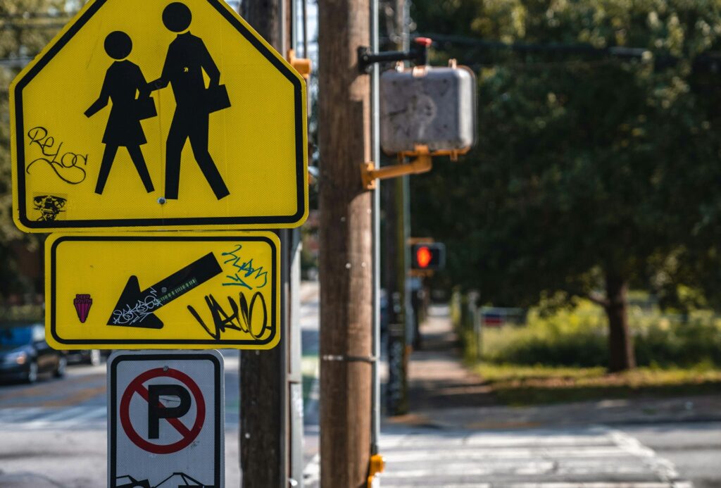 a couple of street signs sitting on the side of a road