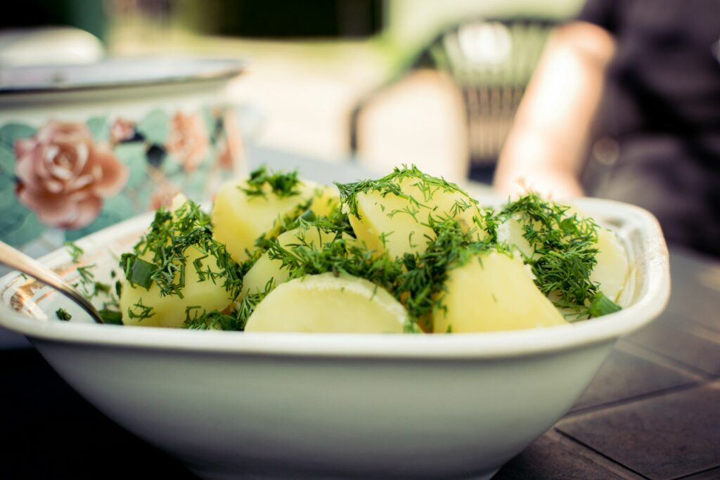 sliced cucumber on white ceramic bowl
