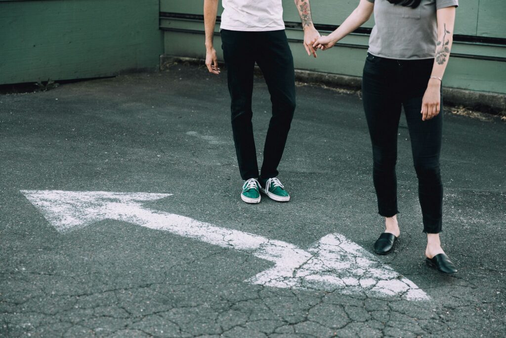 man and woman holding hands
