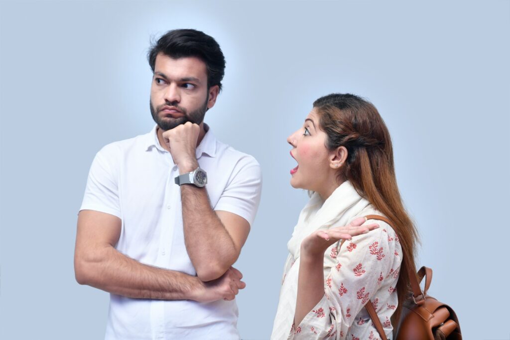 a man and woman looking at each other
