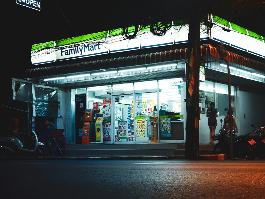 a store front with neon signs
