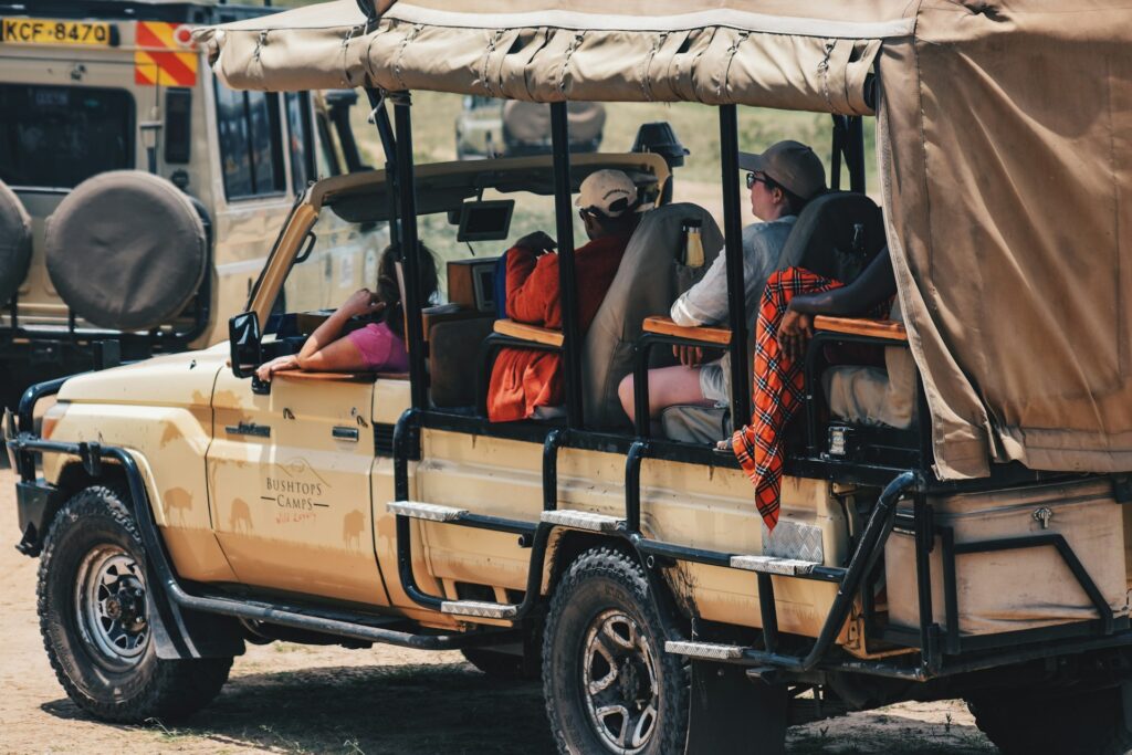a group of people riding in the back of a truck
