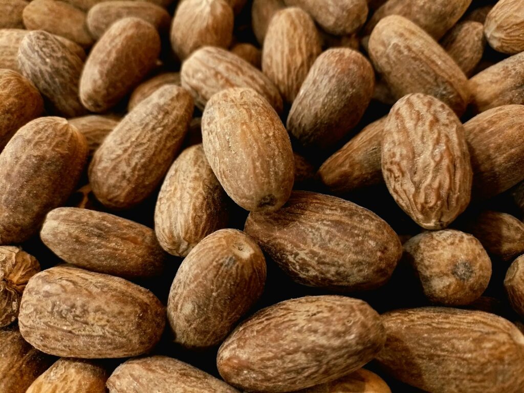 a pile of almonds sitting next to each other
