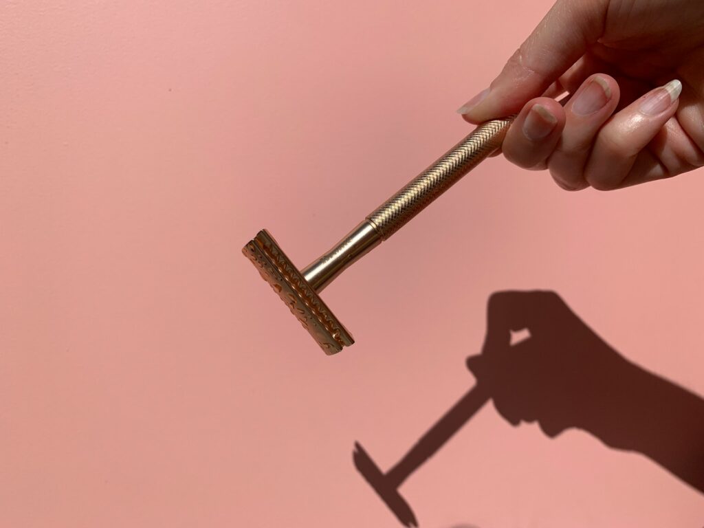 person holding gray metal tool
