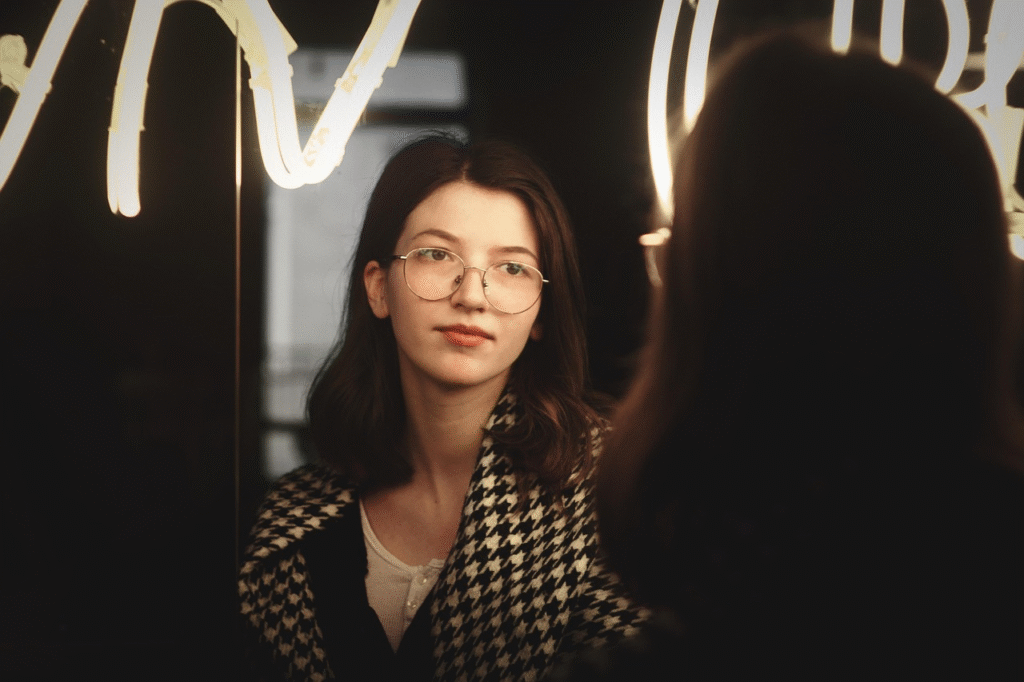 woman lookign in mirror