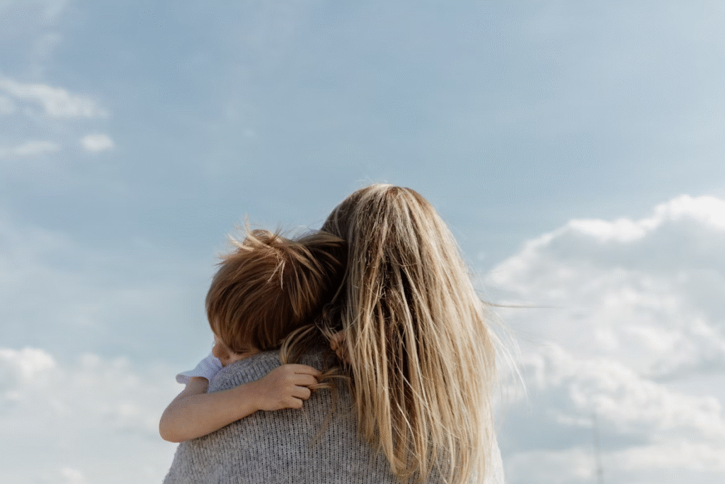 child hugging mother