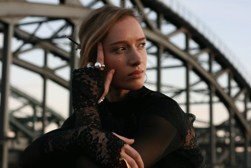 Young Woman in Black Lace with Steel Bridge Background