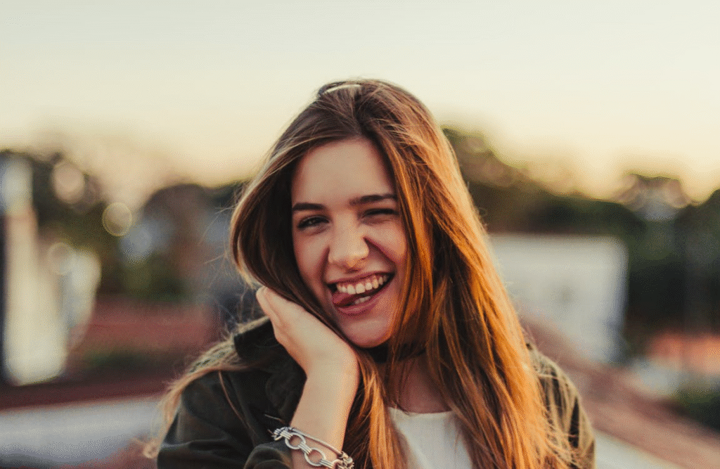 Woman in Black Jacket Smiling
