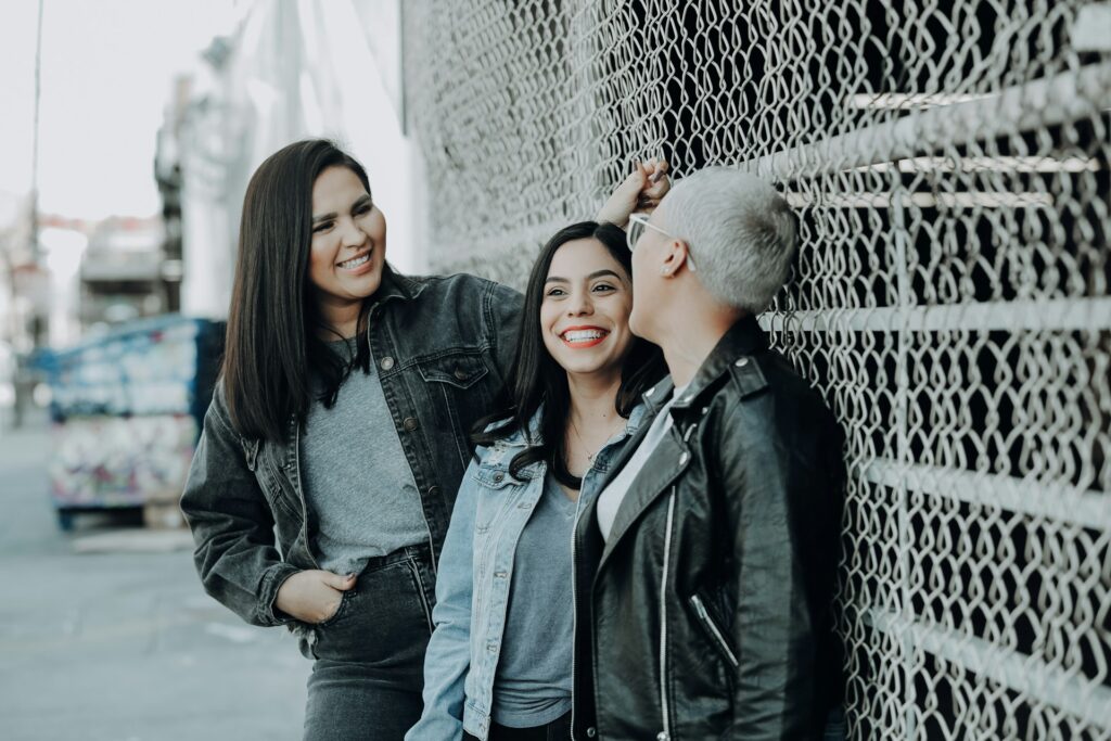 woman in black leather jacket beside woman in black leather jacket
