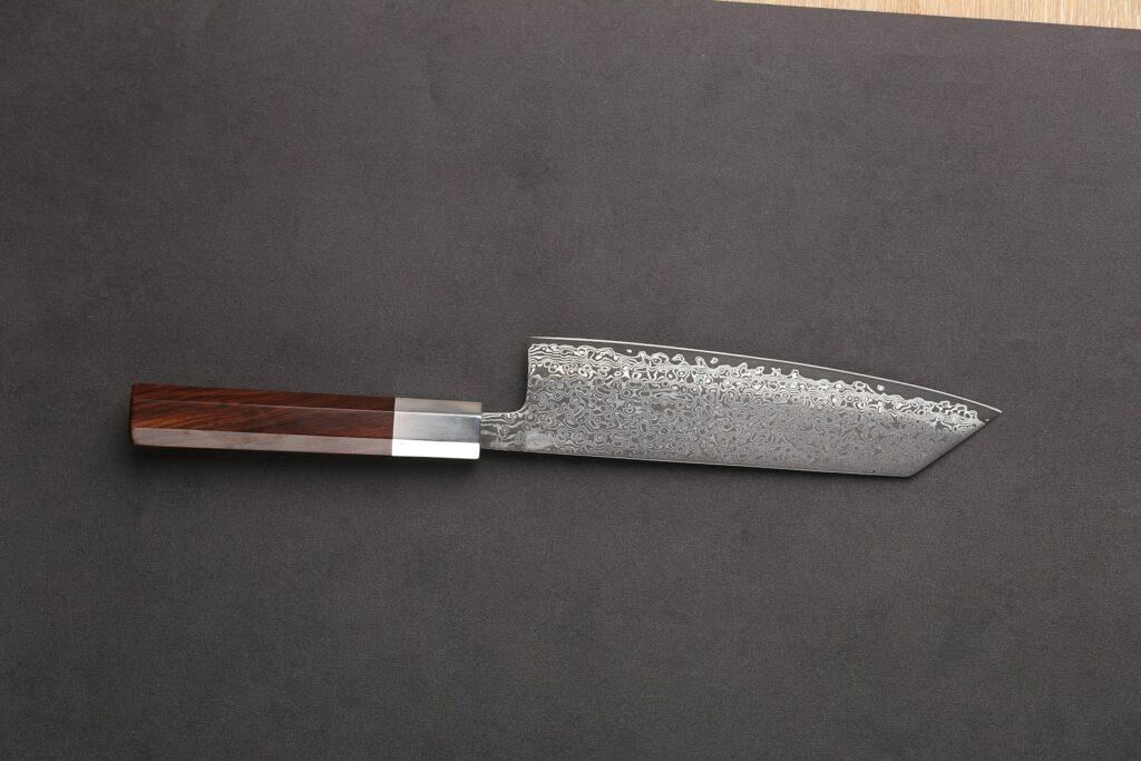 a knife on a cutting board with a wooden handle