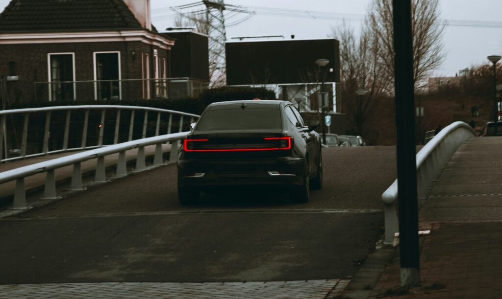 black car on road during daytime
