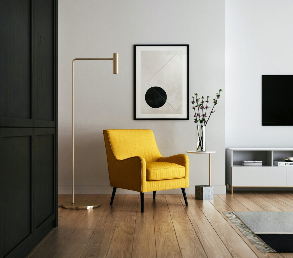brown wooden framed yellow padded chair
