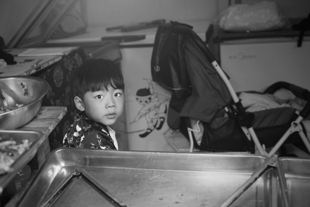 boy sitting in kitchen