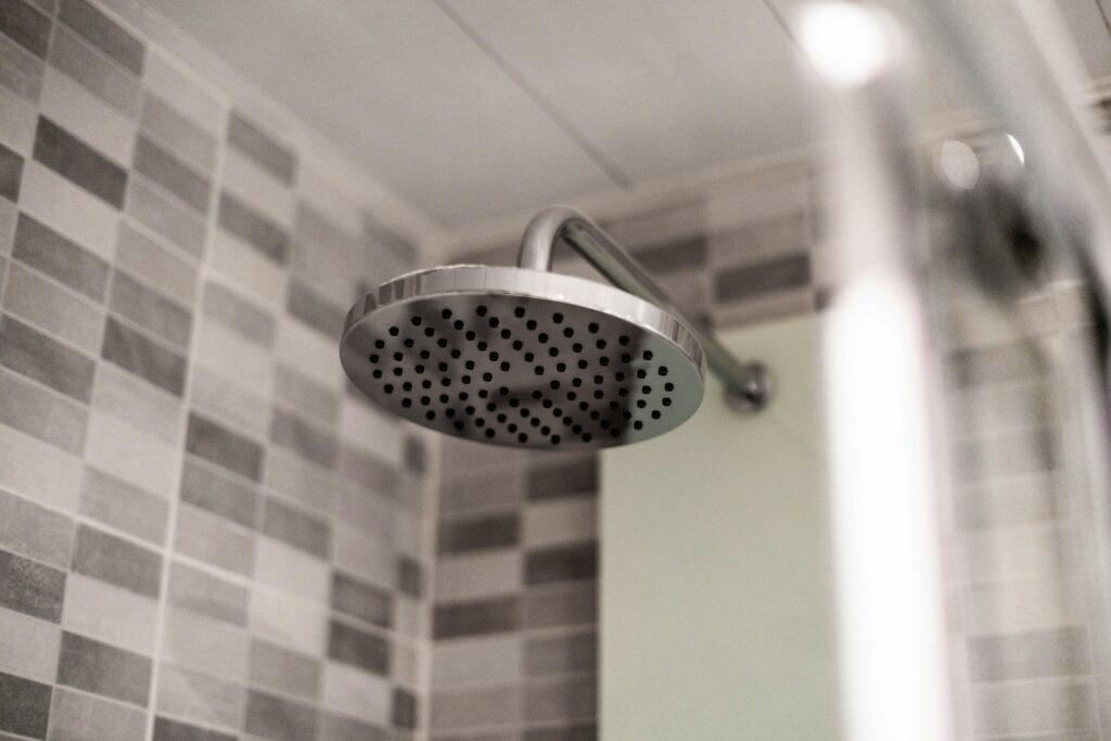 grey stainless steel shower head
