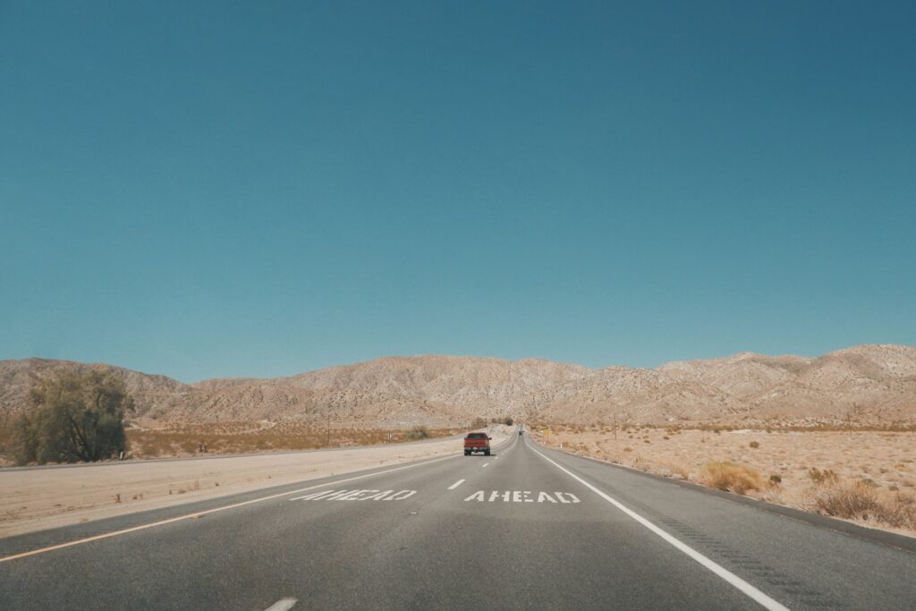 black car on road during daytime
