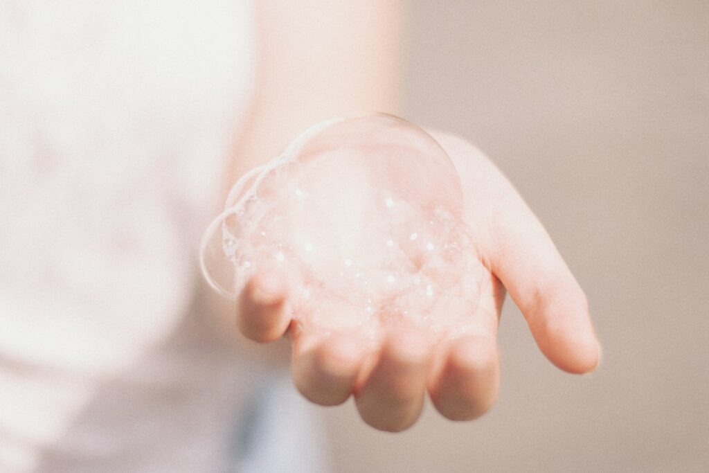 person holding bubbles
