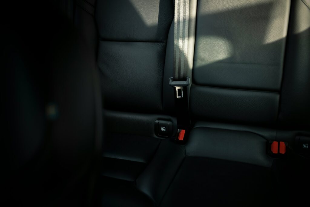 black leather car seat with seat belt
