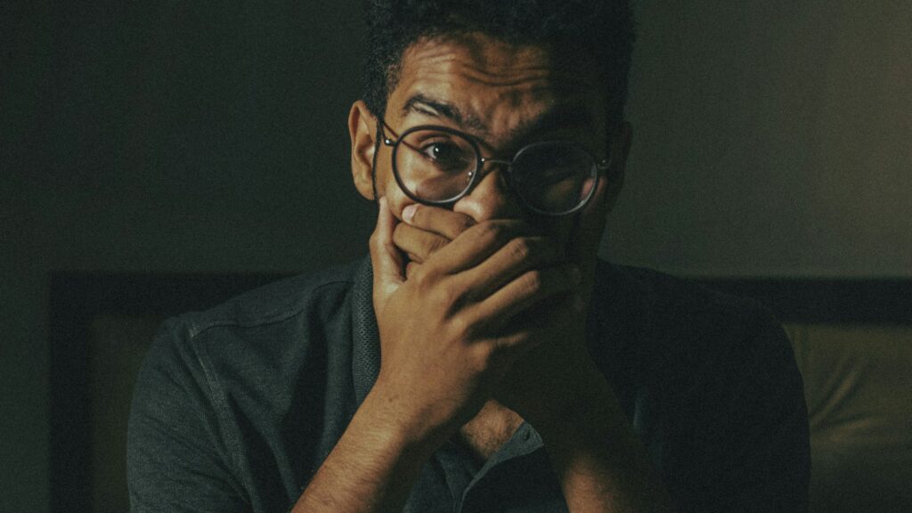 man in black framed eyeglasses
