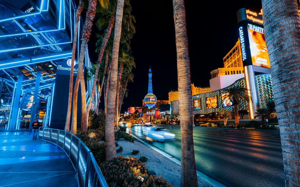 a street with palm trees and buildings
