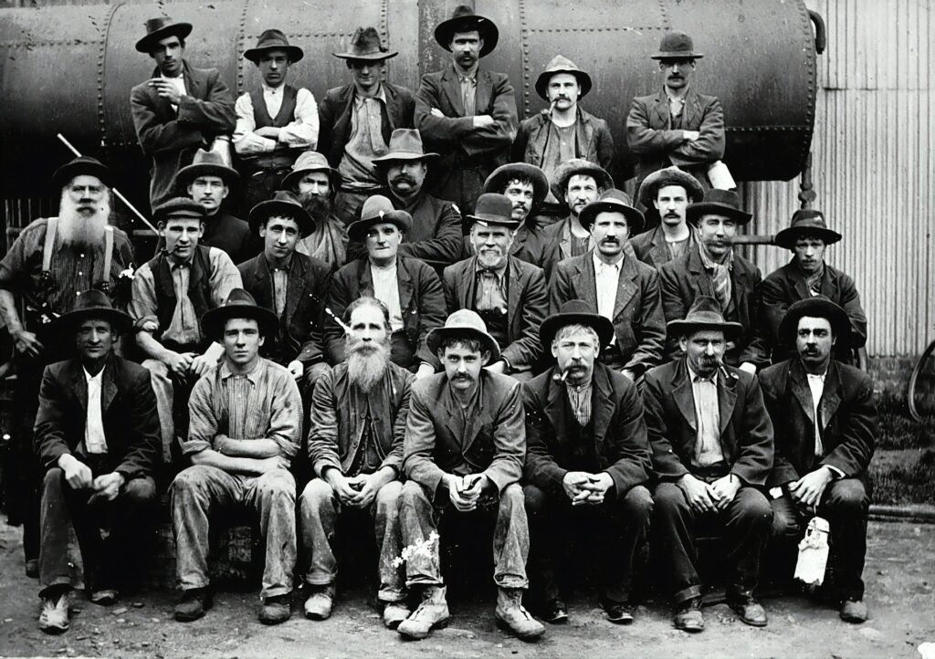 grayscale photo of group of men
