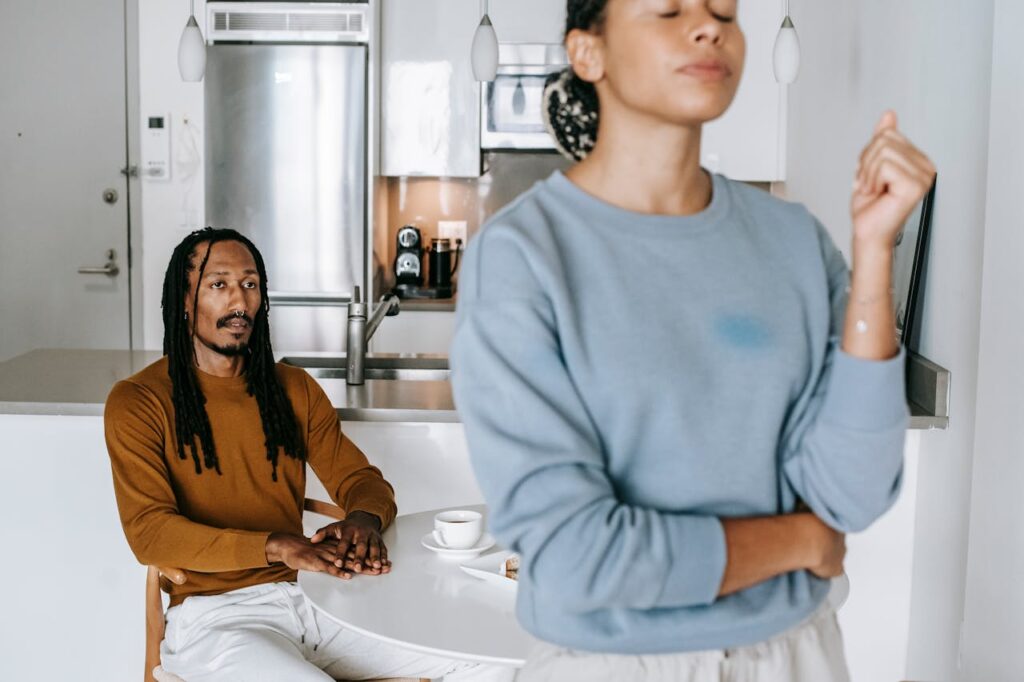 African American couple arguing with each other at home