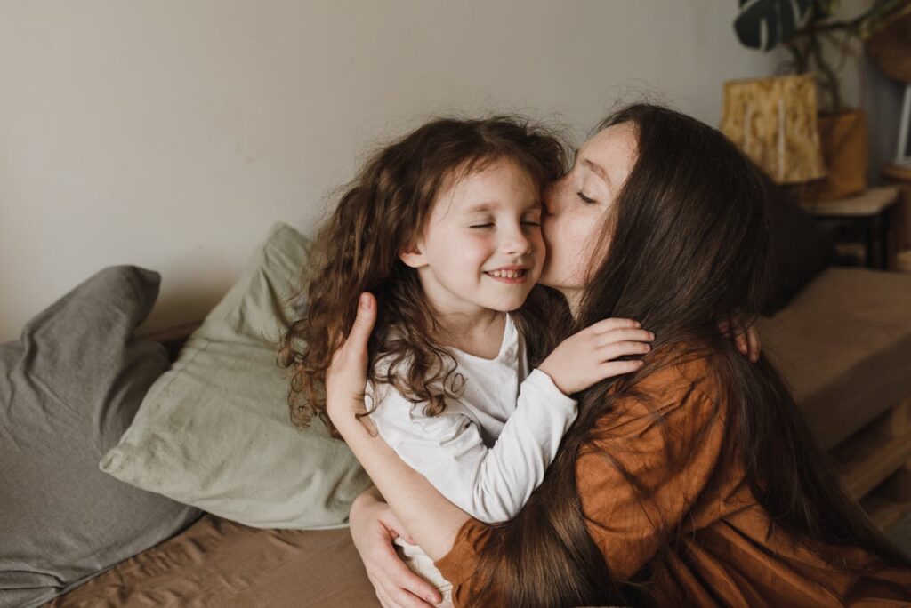 Woman Kissing a Girl
