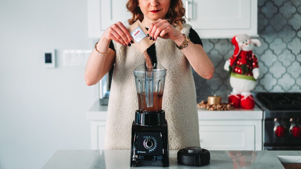 Womna Pouring Powder on the Blender
