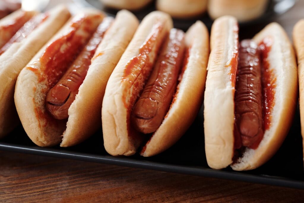 Hotdog Sandwiches on Black Tray

