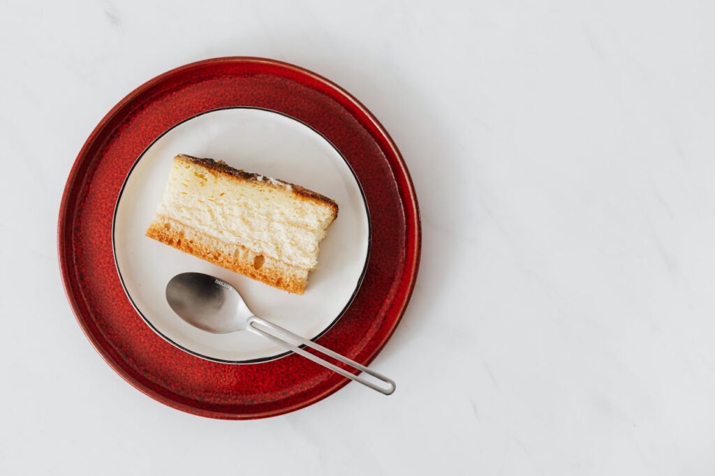 Piece of delicious cheesecake on plate