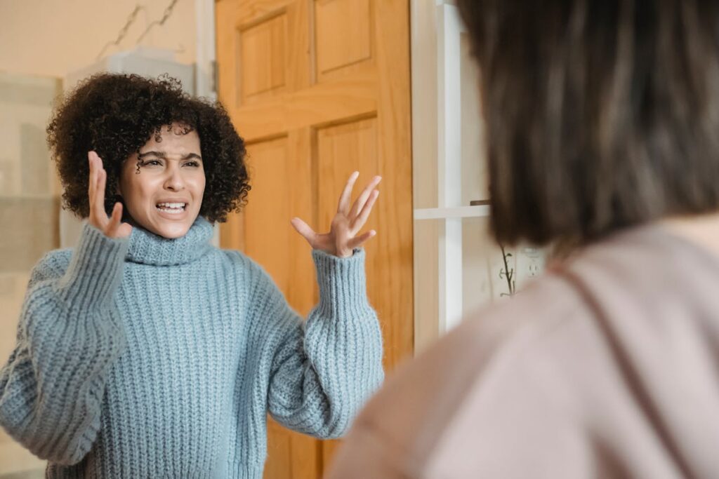 Multiethnic women having conflict at home
