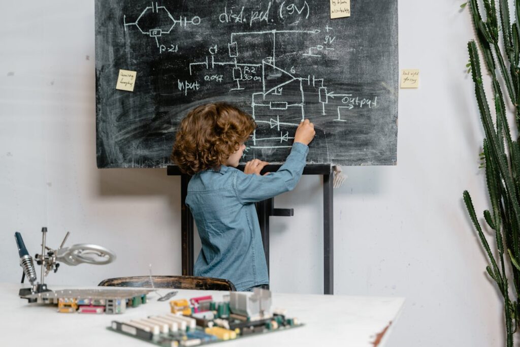 A Boy Drawing on a Blackboard
