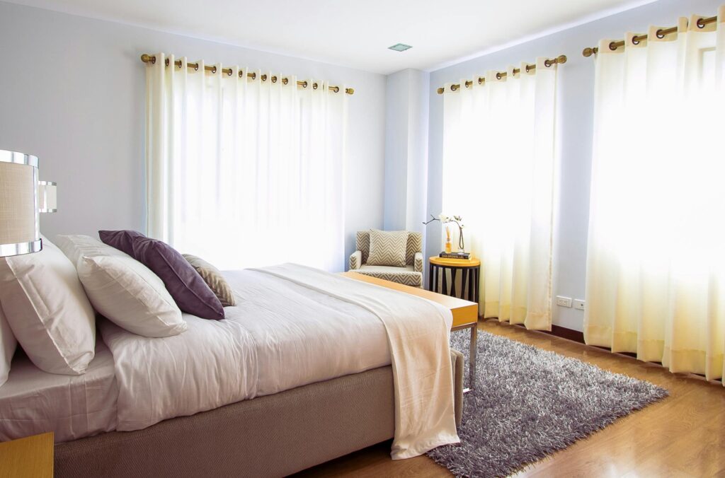 White Bed Comforter during Daytime
