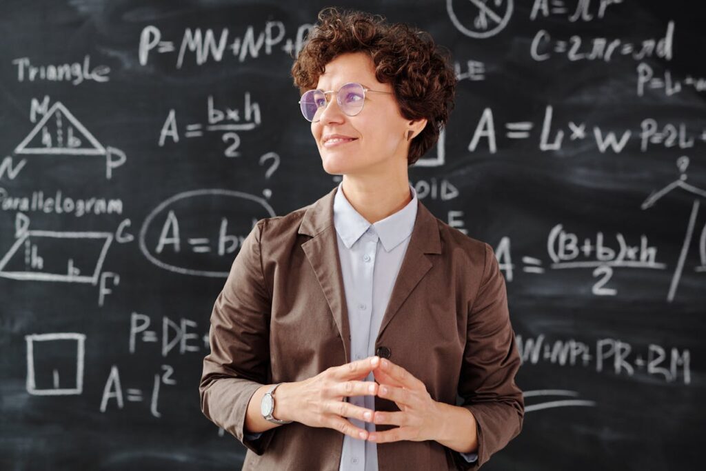 Woman in Brown Blazer Wearing Sunglasses
