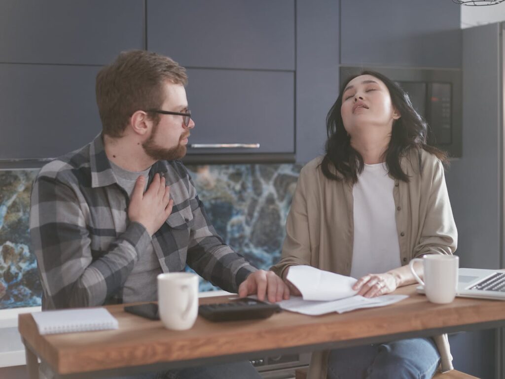 Stressed Couple Explaining Things to each Other
