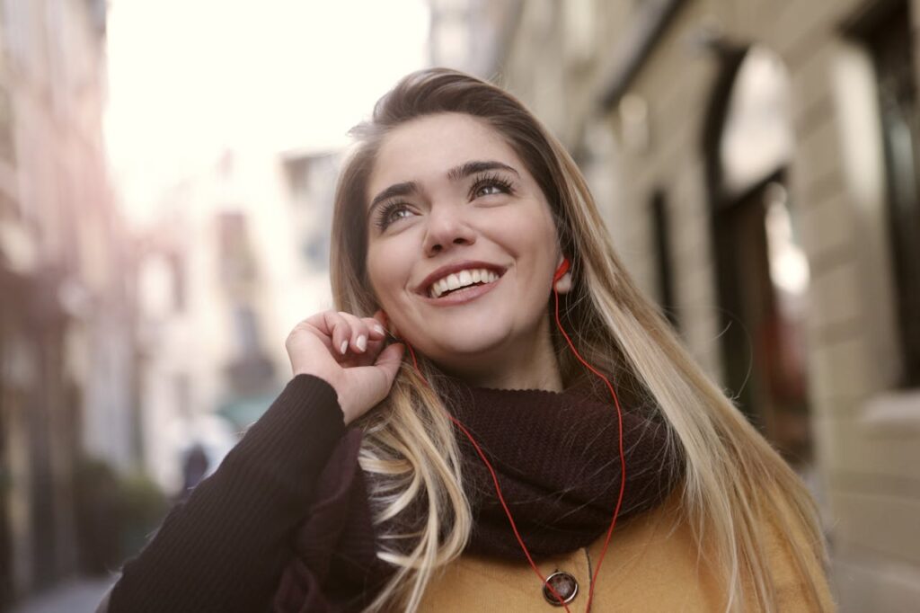 A Joyful Woman Standing Near Building

