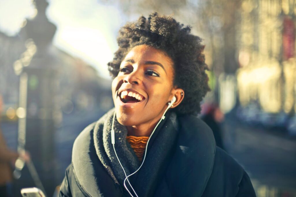 Close-up Photo of a Woman Listening to Music
